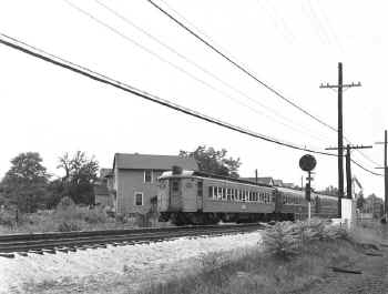 53.  MU Train East Leaving Temp Station-Higbie Ave., Laurelton-View SW - 08-16-58 (Faxon-Keller).jpg (99649 bytes)