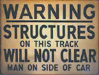 Warning-Structures-on-this track-Will-Not-Clear-Man-On-Side-Of-Car-sign.jpg (35527 bytes)