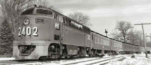 lirr2402_westbound-Stony-Brook_BK-semaphore-block-signals-behind-train_Pedestrian-crossing-SUNY-campus_c.1950's_JohnKrause-GaryEverhart.jpg (85638 bytes)