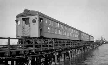 MU Dbl Deck 1327 on 3-car Dbl Deck Train-Reynold's Channel-LEAD-Long Beach-View NW-10-13-63 (Edwards-Keller).jpg (93999 bytes)