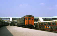 MU Dbl Deck Car and Train at Sta-Belmont Park-N of Hempstead Tpke - 05-71 (Keller).jpg (87074 bytes)