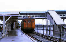 MU Dbl Deck Car and Train at Sta-Belmont Park-N of Hempstead Tpke - 09-71 (Keller).jpg (107492 bytes)