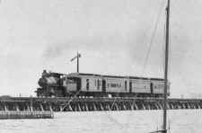 American_Type_Loco_and_Train_on_Trestle-Jamaica_Bay-c. 1900_(Keller).jpg (51387 bytes)